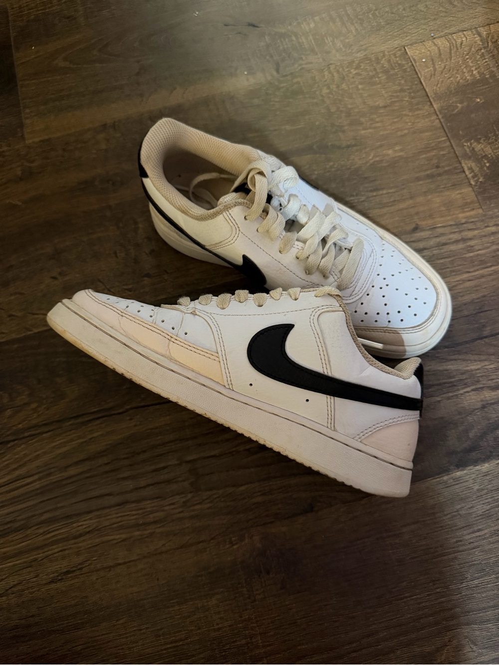 Nike White Low-Top Sneakers with Black Swoosh